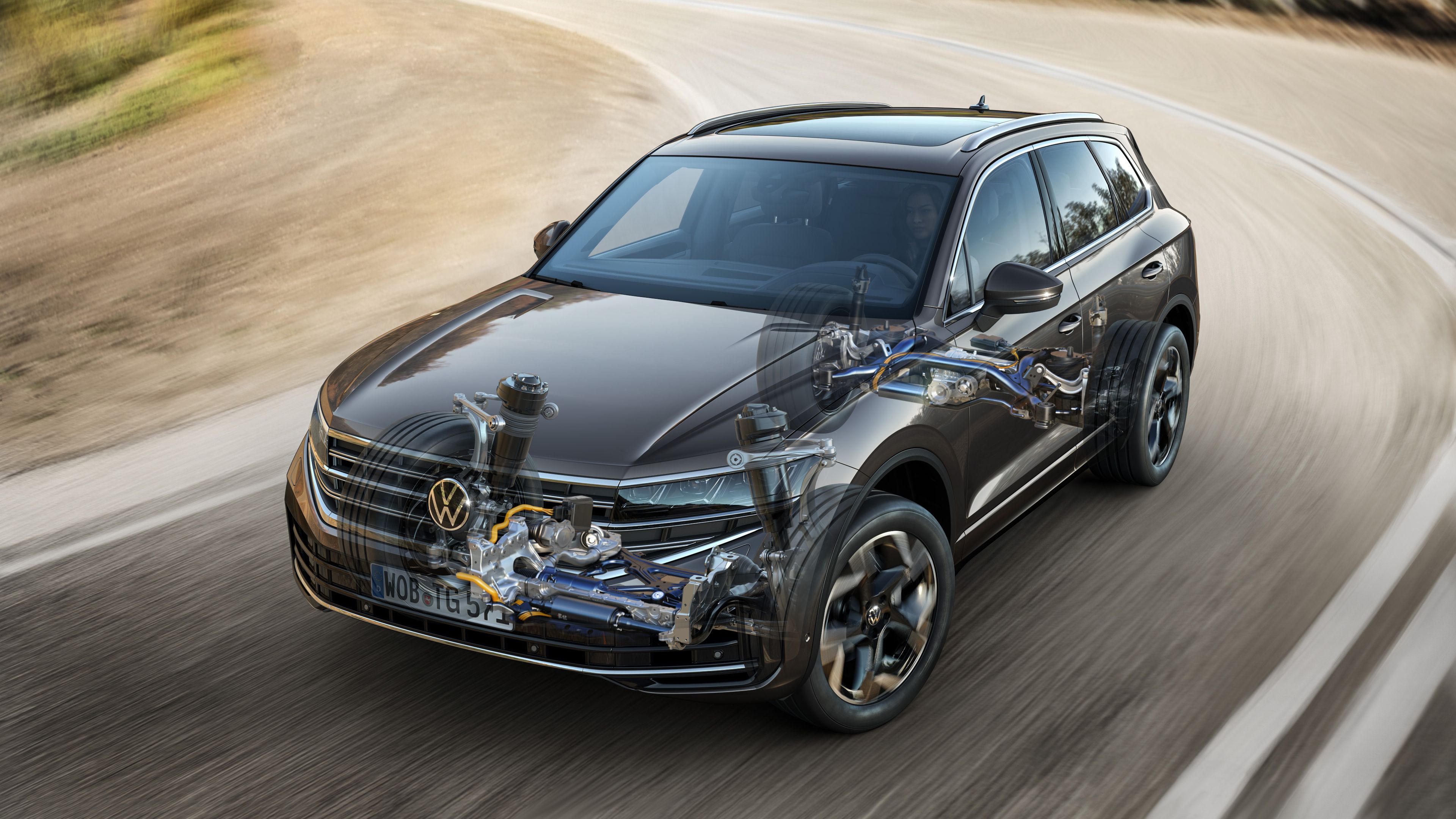 A cutaway illustration showing the internal components of a Volkswagen Touareg R-Line, a premium SUV in motion on a road, providing a superior driving experience.