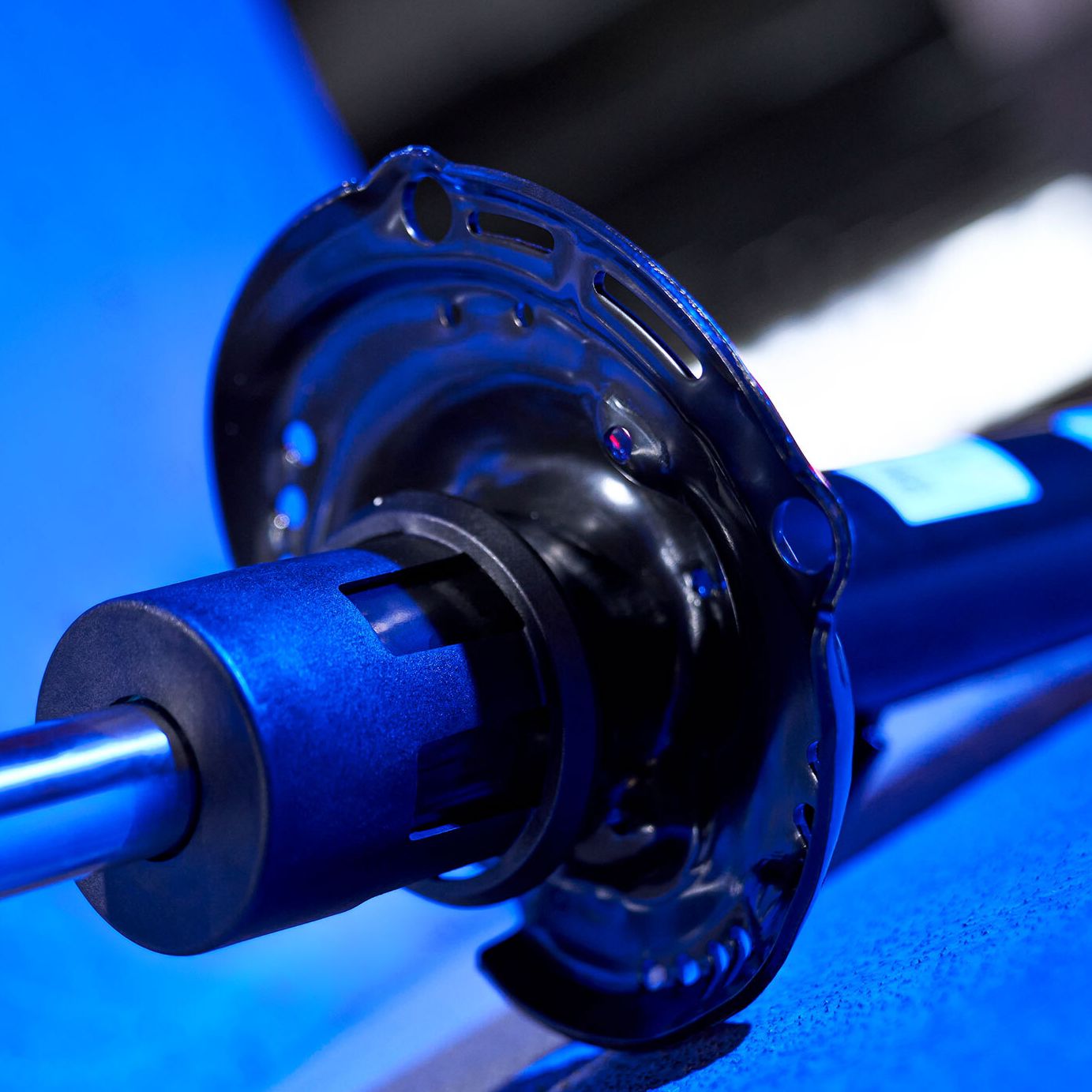 An image of a shock absorber with blue lighting
